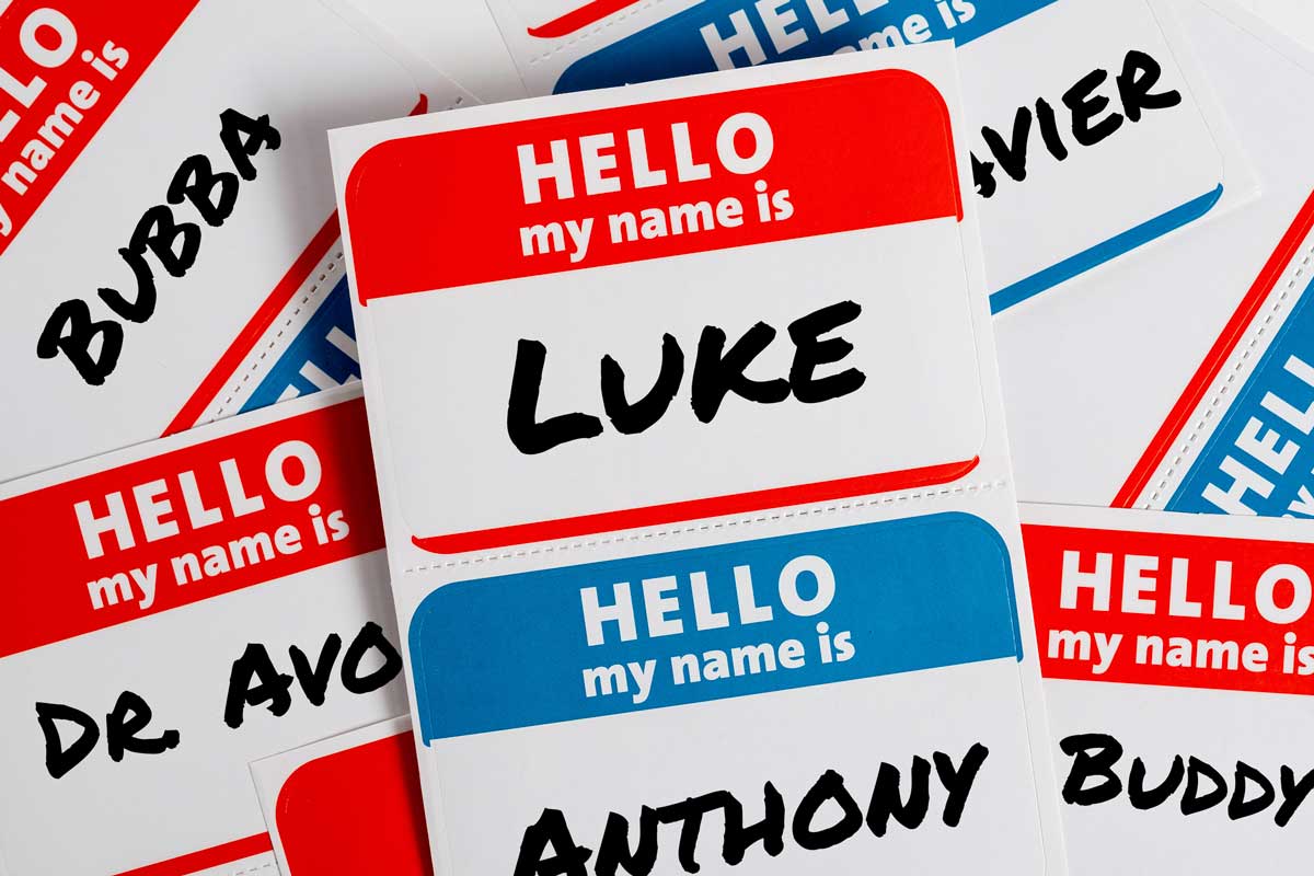 A collection of name tags, each with the header "HELLO my name is." The tag in the center displays the name "LUKE," while other tags around it show names such as "Bubba," "Xavier," "Dr. Avonte," "Anthony," and "Buddy." This playful array can be used for social therapeutic improv sessions.